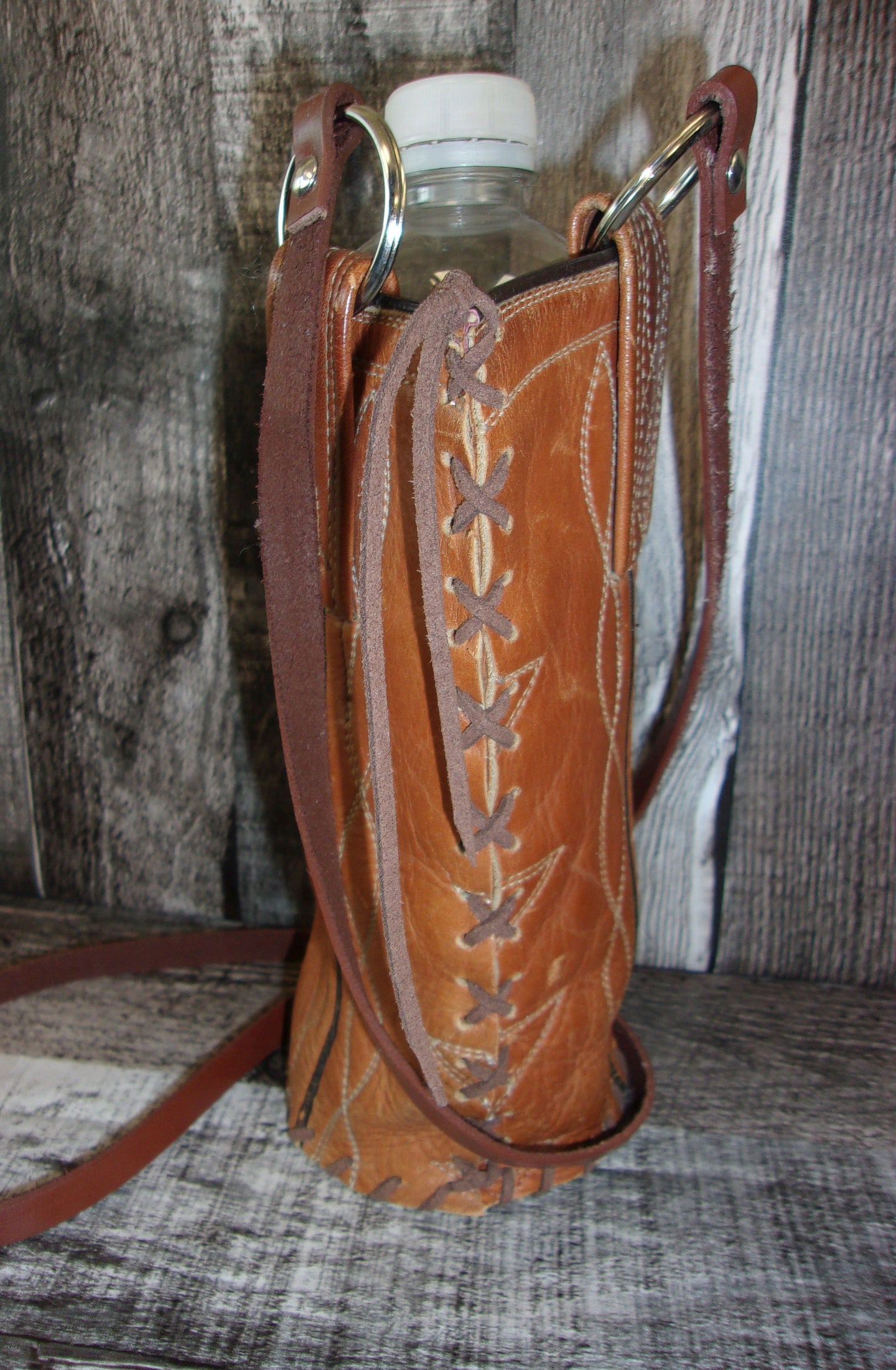 Cowboy Boot Wine Water Tote WA49 handcrafted from cowboy boots. Shop Wine Carrier Bags at ChrisThompsonBags.com and buy the best cowgirl wine tote, leather wine carrier, Leather Wine tote, recycled cowboy boots, unique gift for her, unique gift for him, water bottle caddy, water bottle holder, water bottle tote, western wine carrier, western wine tote, wine lovers gift, Wine Tote at Chris Thompson Bags.